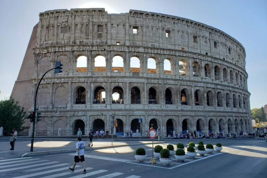 Colosseum, Rome's ancient amphitheater, clear blue sky