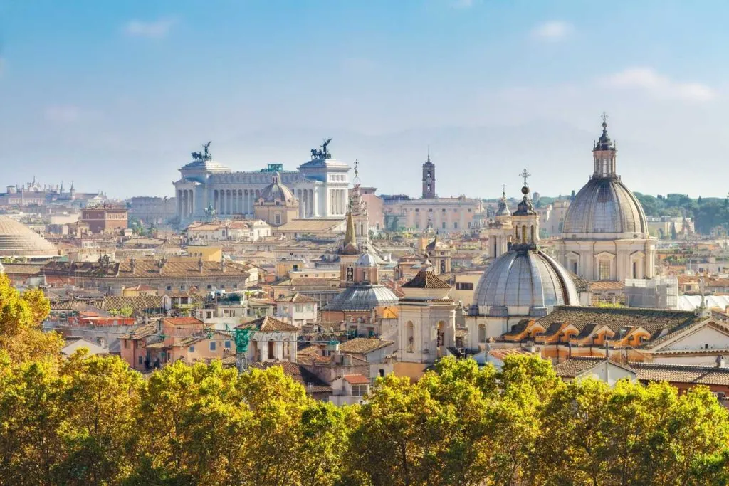 Rome's rooftops and domes — your district decides how much of this you pass on foot every day
