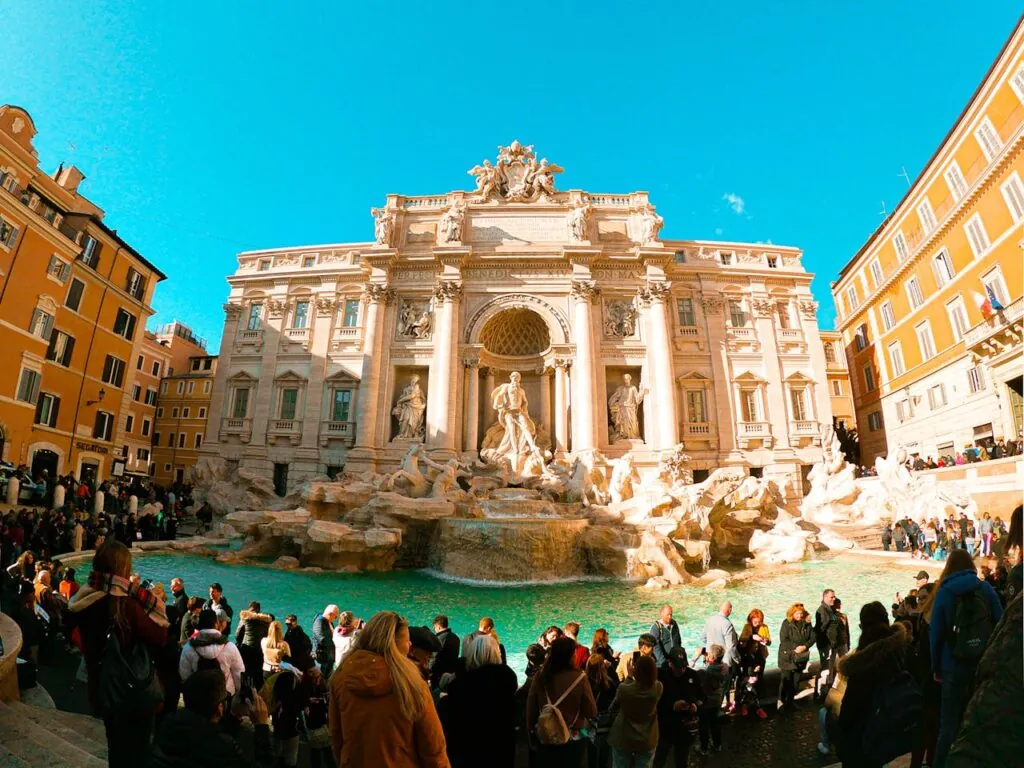 Crowds gathered around the Trevi Fountain, about ten minutes on foot from the Spanish Steps