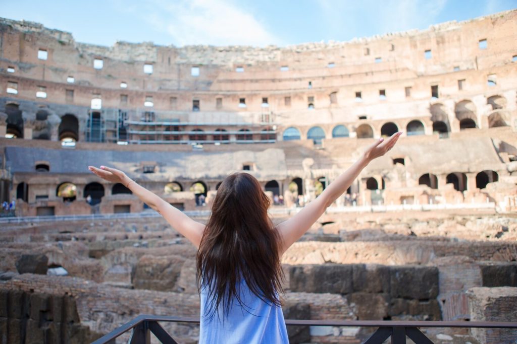 Woman taking a photo inside the colosseum