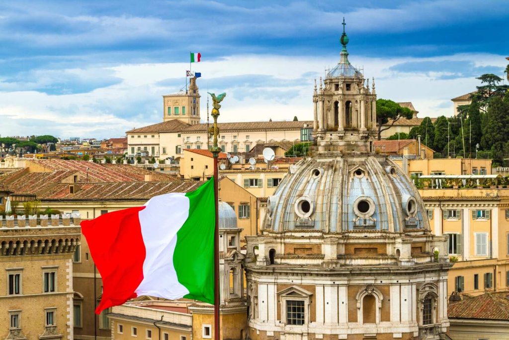 Italian flag over historic Rome buildings, patriotic