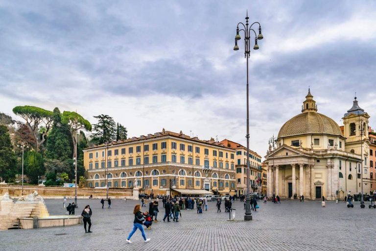 Plaza in Italy with people passing by in winter