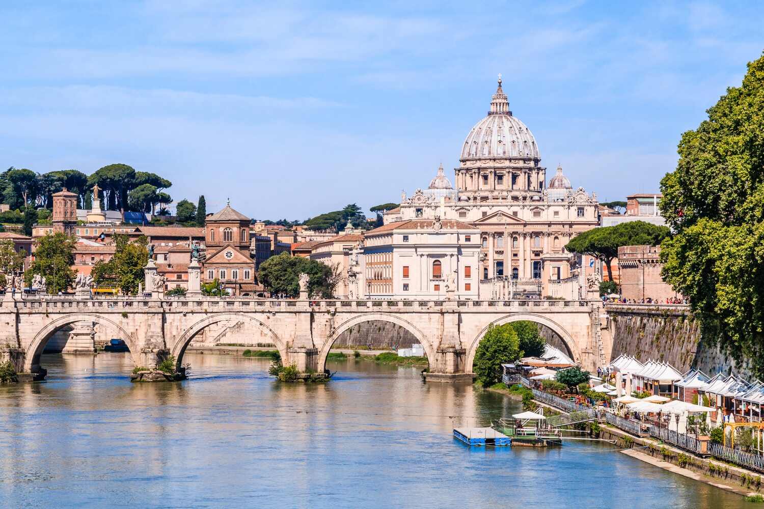 Vatican City over Tiber River, serene dusk